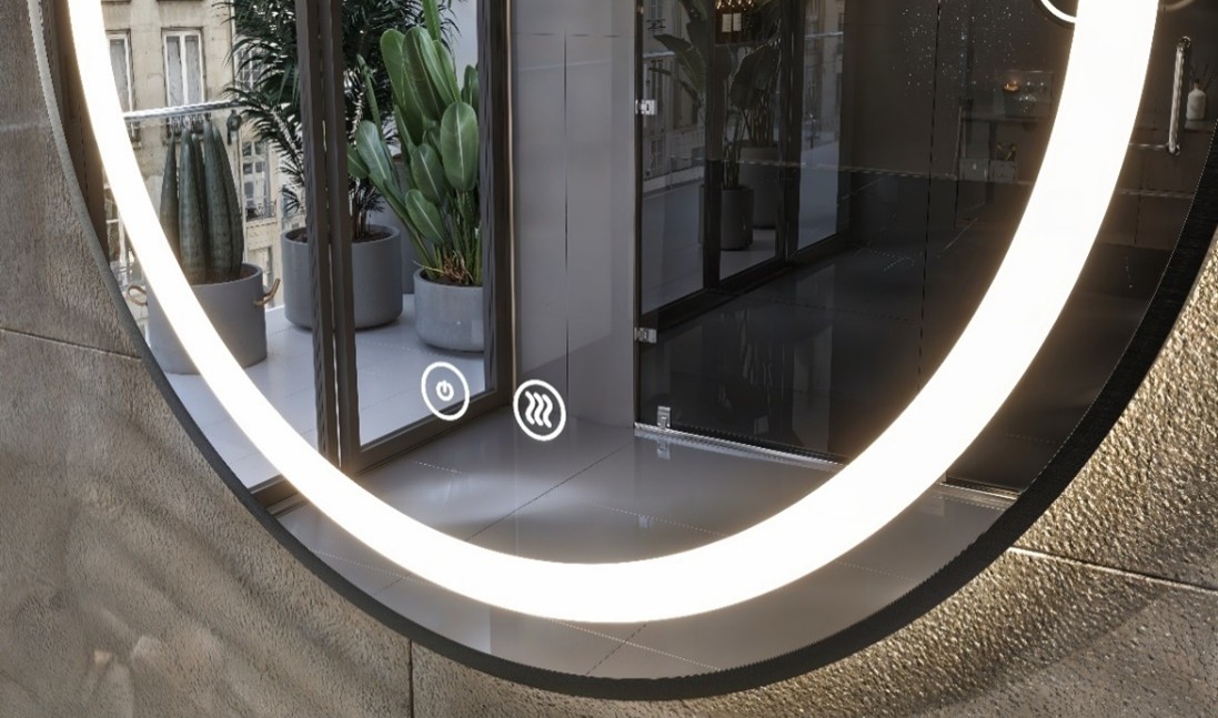 Espejo redondo con iluminación LED y control táctil integrado en un baño contemporáneo.